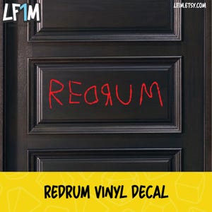 May include: Redrum vinyl decal for a door. The decal is red and is written in a child-like font. The decal is on a dark brown wooden door.