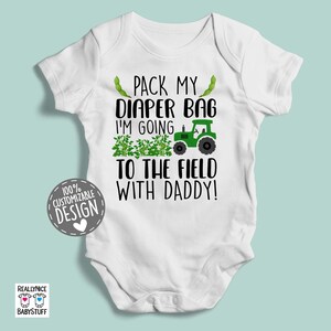 May include: White baby onesie with green tractor and text that reads "Pack my diaper bag I'm going to the field with daddy!"