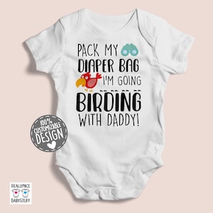 May include: White baby bodysuit with a red bird and binoculars graphic. The text reads "Pack my diaper bag I'm going birding with daddy!"
