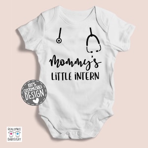 May include: White baby bodysuit with black text that reads "Mommy's Little Intern" and two black stethoscope icons.