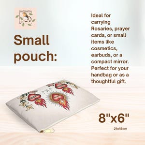 May include: Small, off-white pouch with a gold zipper. The pouch features a design of a heart with flames, roses, and the text "JMP". The pouch measures 8" x 6".