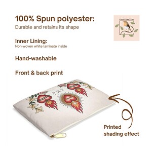 May include: A beige zippered pouch with a front and back print featuring a sacred heart design with flames, roses, and text. The pouch is made of 100% spun polyester and has a non-woven white laminate inner lining. The text on the pouch says "100% Spun polyester: Durable and retains its shape".