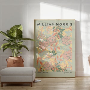 May include: A framed poster with a floral design in shades of pink, green, and yellow. The poster is titled "William Morris" and includes the text "The Met Museum" and "Jasmine, 1872".