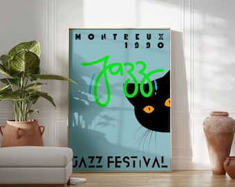 May include: A vintage poster for the 1990 Montreux Jazz Festival. The poster features a black cat peeking out from behind the word "Jazz" in green lettering. The poster has a blue background with a shadow of a palm tree.