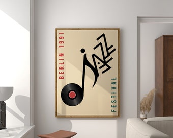 May include: A framed poster with a black and white illustration of a musical note with the word "Jazz" written in a stylized font. The poster has a beige background with the text "Berlin 1991" and "Festival" written in red and blue on the left and right sides of the illustration.