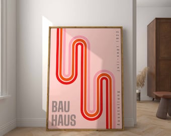 May include: A pink and orange abstract geometric print with the text "BAUHAUS" and the dates "August 1919 - Juli - Sept 1923".