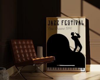 May include: A gold framed poster with a black silhouette of a person playing a saxophone in front of a grand piano. The poster reads "Jazz Festival New Orleans 1976".
