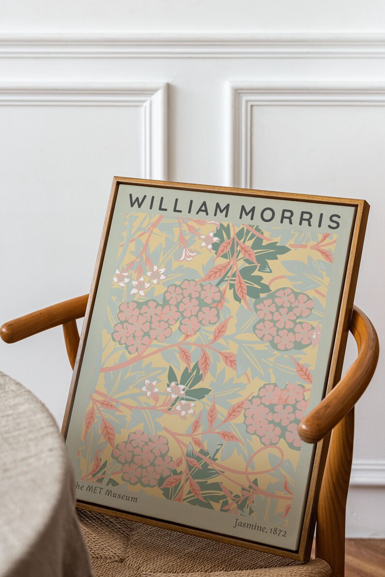 May include: A framed print of a floral design by William Morris, titled "Jasmine, 1872". The print features a yellow background with pink and green flowers and leaves. The print is from the Met Museum.
