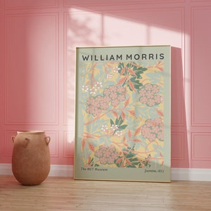 May include: A framed poster with a floral design in shades of pink, green, and yellow. The poster features the text "WILLIAM MORRIS" at the top and "The MET Museum" and "Jasmine, 1872" at the bottom.