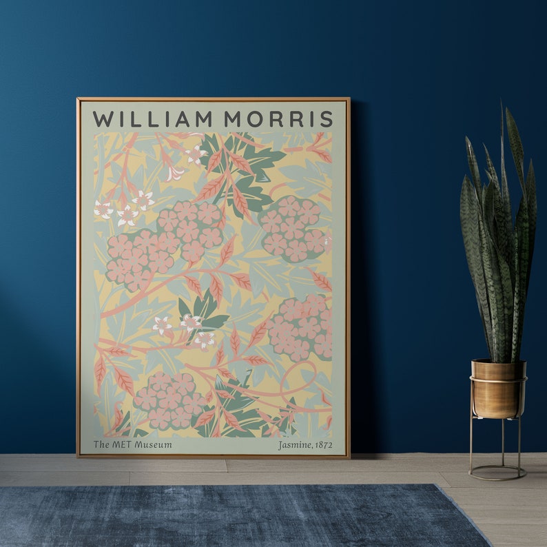 May include: A framed print of a floral pattern by William Morris, titled "Jasmine, 1872". The print features a yellow background with pink and green flowers and leaves. The text "The MET Museum" is at the bottom left corner of the print.