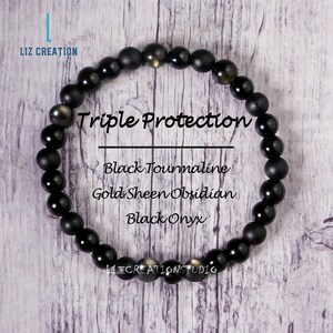 May include: A black beaded bracelet with the text "Triple Protection" and the words "Black Tourmaline, Gold Sheen Obsidian, Black Onyx". The bracelet is made of round, polished beads.