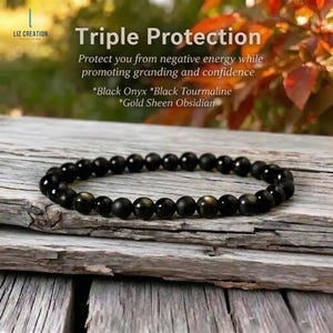 May include: A black beaded bracelet made of Black Onyx, Black Tourmaline, and Gold Sheen Obsidian. The bracelet is displayed on a weathered wooden surface. Text on the image reads "Triple Protection" and describes the bracelet's benefits.
