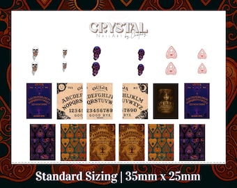May include: A sheet of nail art stickers featuring skulls, planchette designs, and Ouija board graphics. The stickers include the text "CRYSTAL NAIL ART by Compey" and "Standard Sizing | 35mm x 25mm".