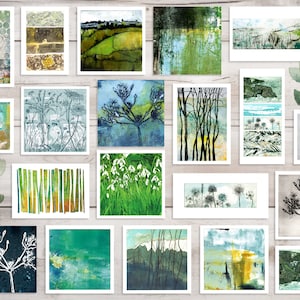 May include: A collection of 20 framed art prints featuring abstract landscapes, nature scenes, and botanical illustrations. The prints are in various shades of green, blue, and white, with some featuring black outlines. The prints are arranged in a grid pattern on a white wooden background.