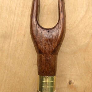 Traditional Hazel country stick with a hand turned Iroko thumb topper and brass finial.
