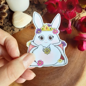 Sticker en vinyle Lapin royal. Princesse / Reine. Fleurs colorées. Animaux blancs et roses dans une cape et une couronne. Art adorable de lapin.