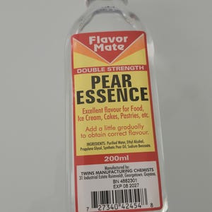 May include: A clear glass bottle of Pear Essence with a white cap. The label reads "Flavor Mate" and "Double Strength Pear Essence." It is for food, ice cream, cakes, and pastries. The bottle contains 200ml.