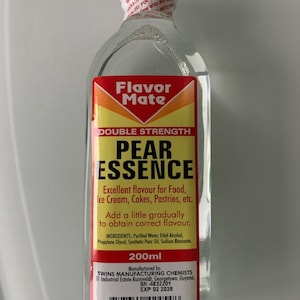 May include: A clear glass bottle of Pear Essence with a red and yellow label. The label reads "Flavor Mate" and "Double Strength Pear Essence." The bottle contains 200ml of liquid and has a white cap.