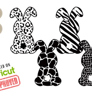 Könnte beinhalten: Drei schwarze und weiße Hasensilhouetten mit verschiedenen Mustern: Leopardenmuster, Zebrastreifen und Krokodilschuppen. Die Hasen sind nach vorne gerichtet mit aufgestellten Ohren.