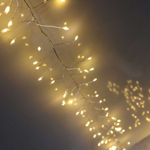 Premium 400 LED Cluster Lights. Lovely Warm White LED Christmas Lights on Silver wire. 5m Garland fairy lights for wonderful cosy décor