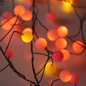 Premium LED Berry Cluster Lights. Sunset (Red, Orange and Yellow) LED Christmas Lights on Black wire. Garland fairy lights for Christmas.