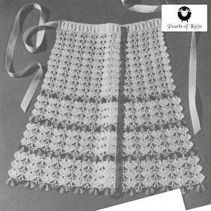 May include: A white crocheted apron with a scalloped edge and a brown crocheted trim. The apron has two long white ribbon ties. The apron is labeled "Pearls of Knits".