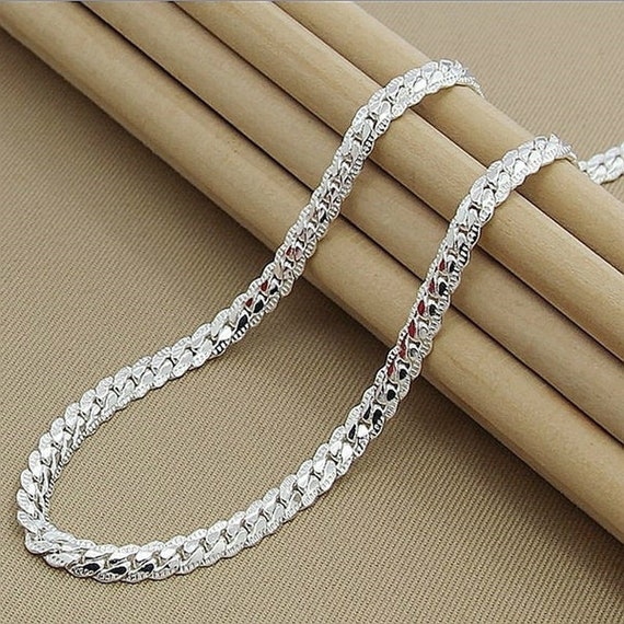UNALLOYED★男女兼用★人気★BUTTON CHAIN NECKLACE / SILVER il_fullxfull.5399399889_l46c.jpg