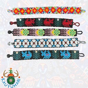 May include: Five colorful beaded bracelets with different patterns. The bracelets are made with small, colorful beads and have a simple design. The bracelets are all about the same length and width.