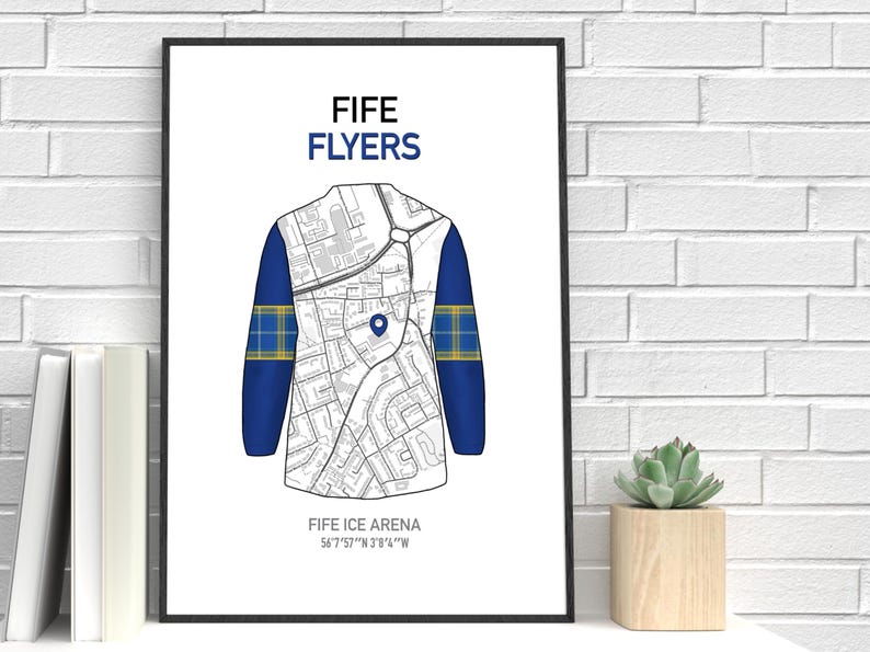 May include: A framed print featuring a stylized illustration of a hockey jersey. The jersey design incorporates a map, with blue sleeves and a yellow and blue plaid pattern. The text "FIFE FLYERS" and "FIFE ICE ARENA" are displayed.