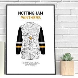 May include: A framed print featuring a stylized map design of a hockey jersey. The jersey design incorporates a map of Nottingham, with the text "NOTTINGHAM PANTHERS" in gold. The location of Motorpoint Arena is also indicated.