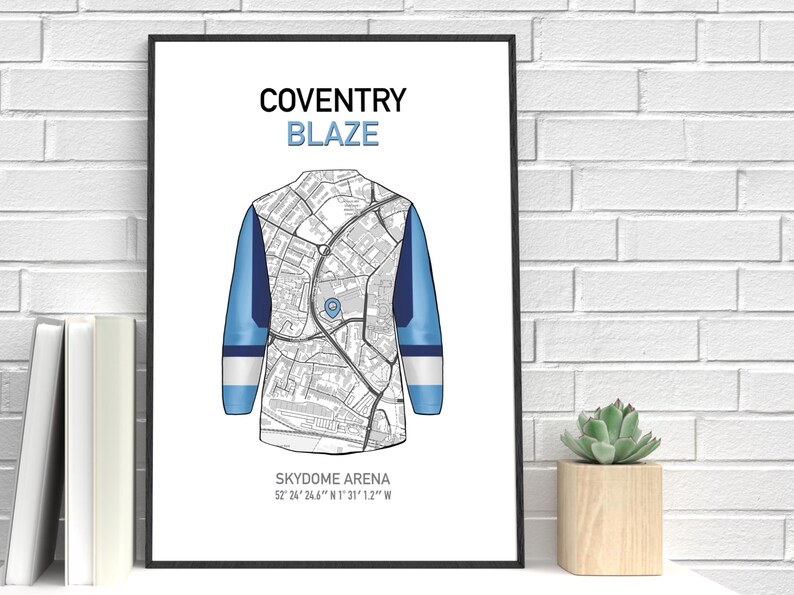 May include: A framed print featuring a stylized map design of a jersey. The jersey design is in white, blue, and navy. The text "COVENTRY BLAZE" is at the top, with "SKYDOME ARENA" and coordinates at the bottom.