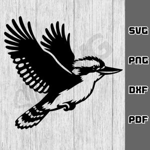 May include: A black and white silhouette of a kookaburra bird in flight, with its wings outstretched. The image shows detailed feathering and a prominent beak. The text "SVG", "PNG", "DXF", and "PDF" is included.