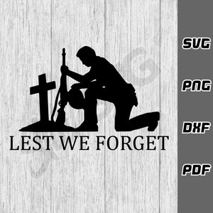 May include: Black silhouette of a person kneeling at a grave with a rifle and helmet. The text "LEST WE FORGET" is below the image.
