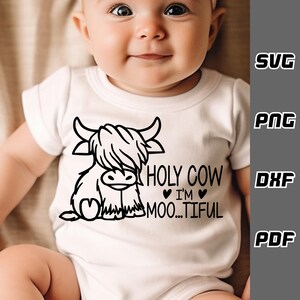 May include: A white onesie with a black and white illustration of a Highland cow and the text "HOLY COW I'M MOO...TIFUL".