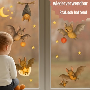 May include: Window clings featuring cartoon bats, stars, and a crescent moon. The bats are depicted with friendly expressions, some holding lanterns or stars. The text "wiederverwendbar" and "Statisch haftend" is visible.