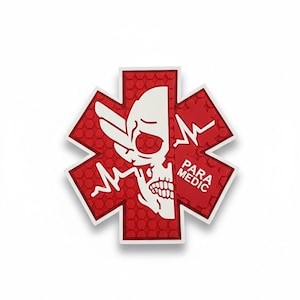 May include: A red and white Star of Life emblem with a skull graphic. The emblem has a textured, honeycomb pattern and the words "PARA MEDIC" are printed on the right side.