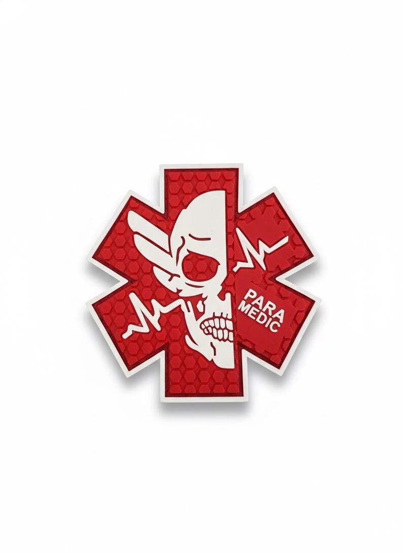 May include: A red and white Star of Life emblem with a skull graphic. The emblem has a textured, honeycomb pattern and the words "PARA MEDIC" are printed on the right side.
