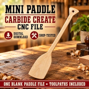May include: A light-colored wooden mini paddle with a hole in the handle. The image features text reading MINI PADDLE CARBIDE CREATE CNC FILE, DIGITAL DOWNLOAD, SHOP-TESTED, and ONE BLANK PADDLE FILE • TOOLPATHS INCLUDED on a wooden surface.