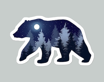 May include: Silhouette of a bear with a starry night sky and a full moon inside. The bear is walking through a forest of pine trees.
