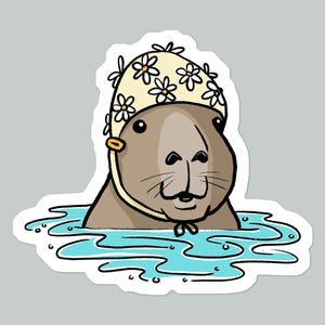 May include: A cartoon capybara wearing a yellow and white flower-patterned shower cap, swimming in blue water.
