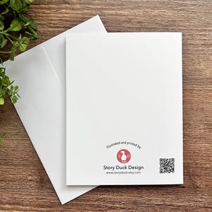 May include: A white card with a red logo that says "Story Duck Design" and a QR code. The text below the logo says "Illustrated and printed by Story Duck Design www.storyduck.etsy.com".
