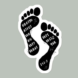 May include: Black and white sticker of two footprints with text inside each footprint. The left footprint has the text "HBOTM ATFT WB GN WIPP WBGT". The right footprint has the text "WPS WST2 4GR 152.7".