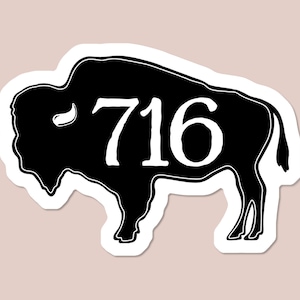 May include: Black and white silhouette of a buffalo with the number 716 printed on its side.