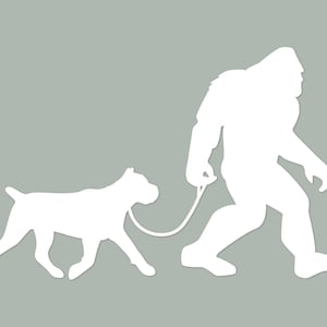 May include: A white silhouette of Bigfoot walking a dog on a leash. The dog is a large breed with a short tail.