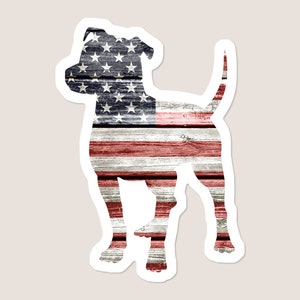 May include: Silhouette of a dog with the American flag design on a woodgrain background.