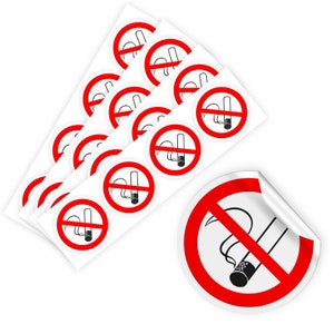 Op de afbeelding: Een pak van tien rode en witte stickers met 'Niet roken'. Elke sticker heeft een rode cirkel met een diagonale streep erdoorheen en een zwart silhouet van een sigaret met rook.