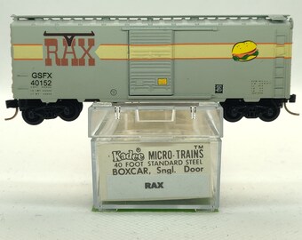Custom painted and decaled N-scale Kadee Micro-Trains boxcar, grey with Rax logo