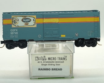Custom painted and decaled N-scale Kadee Micro-Trains boxcar, blue with Rainbo Bread logo