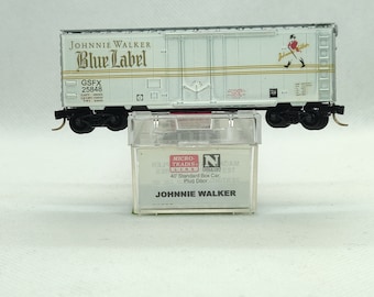 Custom painted and decaled N-scale Micro-Trains boxcar, white and silver with Johnnie Walker logo