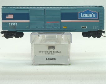 Custom painted and decaled N-scale Micro-Trains boxcar, blue with Lowe's logo